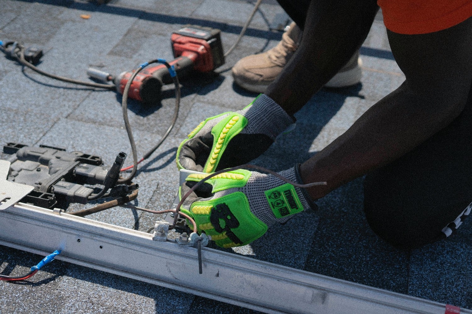 Harnessing the Power of the Sun: A Beginner’s Guide to Solar Energy 7 Worker installing solar panel components